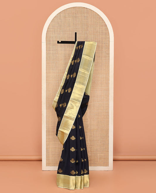 Black Vasundhara Lite Silk Mix Saree Gleamed Up with Floral Zari Buttas, Complemented by a Contrast Border of Salngai, Paisa, and Thilakam Designs, Zari Woven Pallu, and a Contrast Blouse