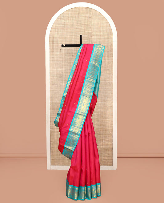 Pink Vasundhara Silk Saree, Subtly Sparkled With Zari Buttas All Over Its Body, Complemented by Zari Buttas All Over Its Body, Complemented by Contrast Border of Thilakam, Banaras, and Mayil Designs Grand Jaal Pallu and Paired with a Contrast Blouse