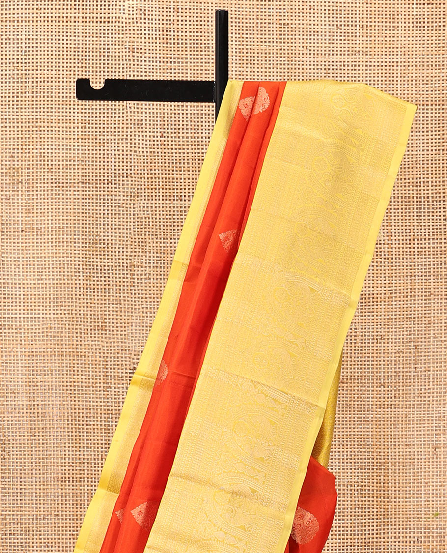 Orange Zari Buttas Vasundhara Silk Saree, Complemented by a Contrast Traditional Border of Mayil Designs, Sparsely Threaded Pallu, and a Contrast Blouse