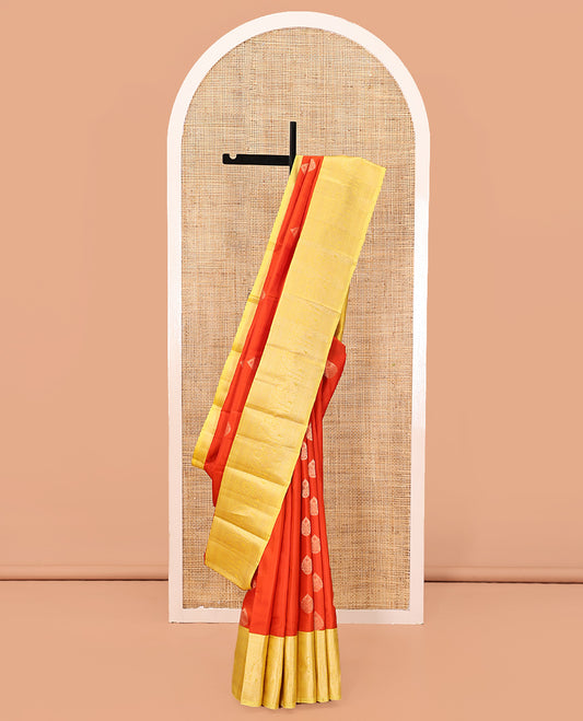Orange Zari Buttas Vasundhara Silk Saree, Complemented by a Contrast Traditional Border of Mayil Designs, Sparsely Threaded Pallu, and a Contrast Blouse