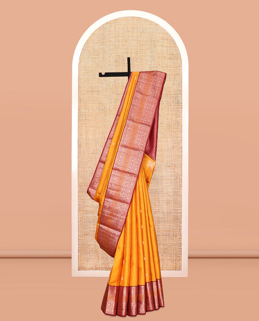 Yellow Vasundhara Silk Saree, Finely Crafted with Zari Buttas, Contrast Border of Thilakam Mokku, Muthu, Mayil, Chakram, Neli, and Kuthirai Designs, Jaal Pallu, and a Contrast Blouse
