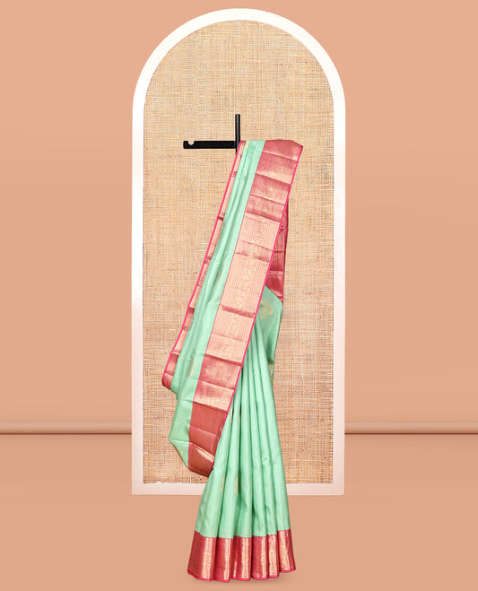 Green Vasundhara Silk Saree, Delicately Woven with Zari Buttas, Contrast Border of Thilakam, Kathir, Mayil Kann, Cross Kamalam, and Yaali Designs, Grand Pallu, and Contrast Blouse