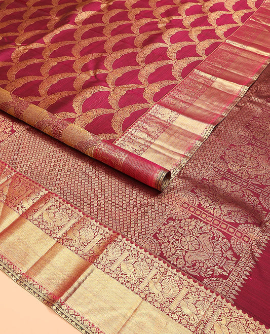 Maroon jacquard kanchipuram silk saree, zari border of thilakam, kodi visiry, and mayil designs, and jaal pallu