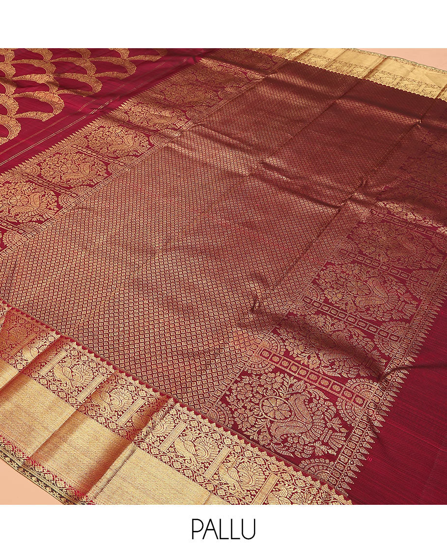 Maroon jacquard kanchipuram silk saree, zari border of thilakam, kodi visiry, and mayil designs, and jaal pallu
