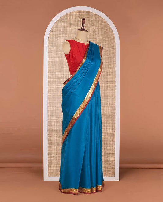 Blue Plain Mysore Silk Saree, Complemented by Contrast Zari Border of Intricate Designs, Subtly Woven Pallu of Zari Stripes, and Paired with a Contrast Blouse