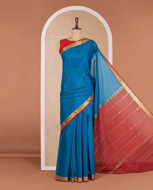 Blue Plain Mysore Silk Saree, Complemented by Contrast Zari Border of Intricate Designs, Subtly Woven Pallu of Zari Stripes, and Paired with a Contrast Blouse
