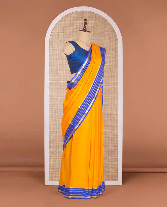 Orange Plain Mysore Silk Saree, Complemented by Contrast Traditional Zari Design Border, Gleaming Zari-Woven Pallu of Zari Stripes, and Paired with a Contrast Blouse