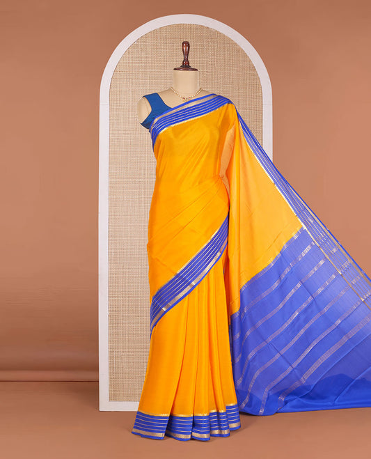 Orange Plain Mysore Silk Saree, Complemented by Contrast Traditional Zari Design Border, Gleaming Zari-Woven Pallu of Zari Stripes, and Paired with a Contrast Blouse