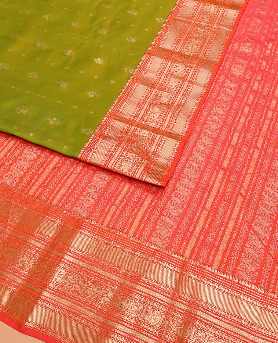 Green Vasundhara Lite Silk Mix Saree Accentuated with Zari Buttas, Complemented with a Contrast Border Featuring Manga, Muthu, Kamalam, Neli, Vanki, and Mayil Designs, a Grandly Zari-Decked-Up Pallu, and a Contrast Blouse