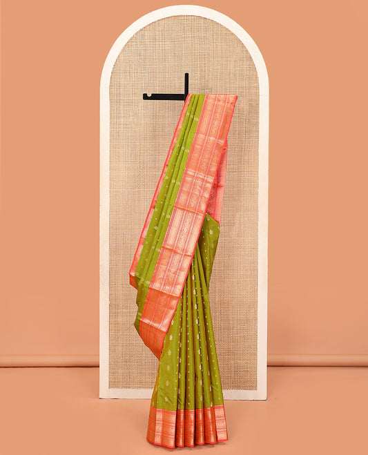 Green Vasundhara Lite Silk Mix Saree Accentuated with Zari Buttas, Complemented with a Contrast Border Featuring Manga, Muthu, Kamalam, Neli, Vanki, and Mayil Designs, a Grandly Zari-Decked-Up Pallu, and a Contrast Blouse