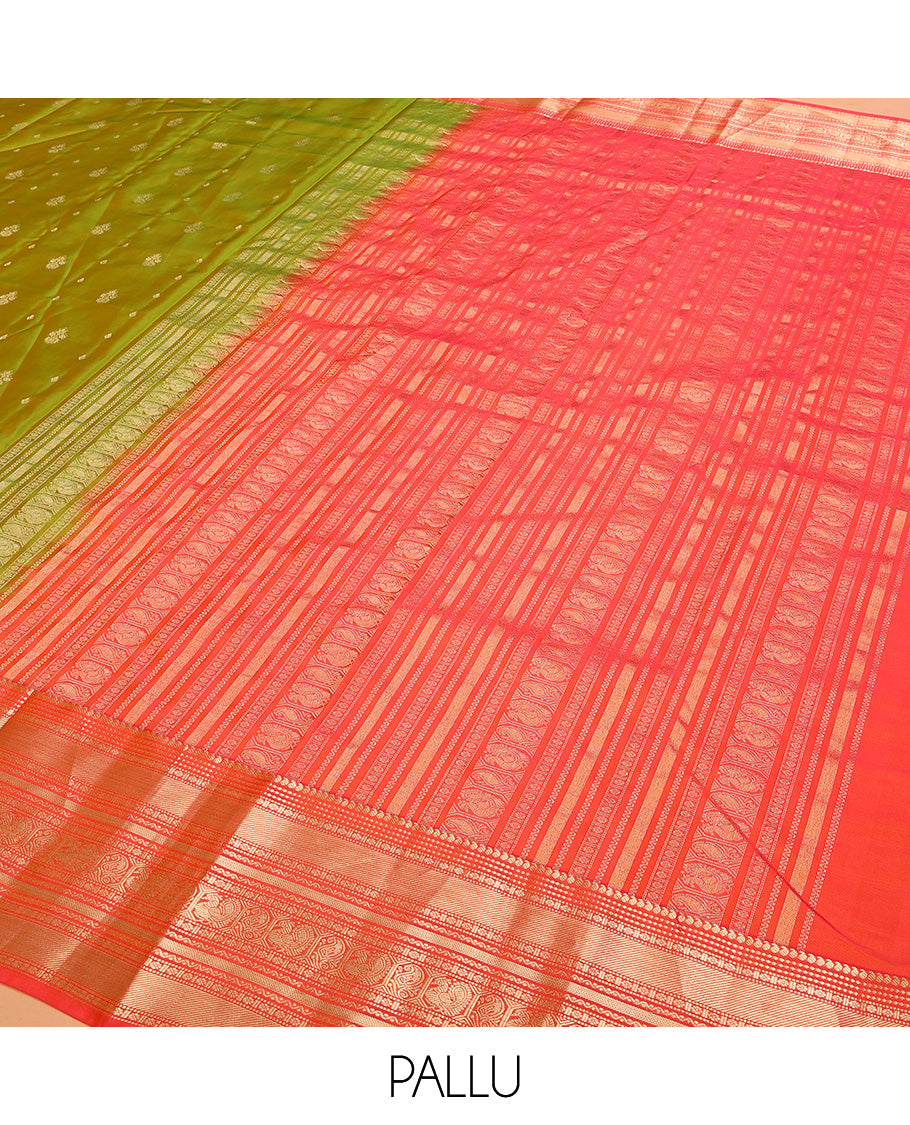 Green Vasundhara Lite Silk Mix Saree Accentuated with Zari Buttas, Complemented with a Contrast Border Featuring Manga, Muthu, Kamalam, Neli, Vanki, and Mayil Designs, a Grandly Zari-Decked-Up Pallu, and a Contrast Blouse