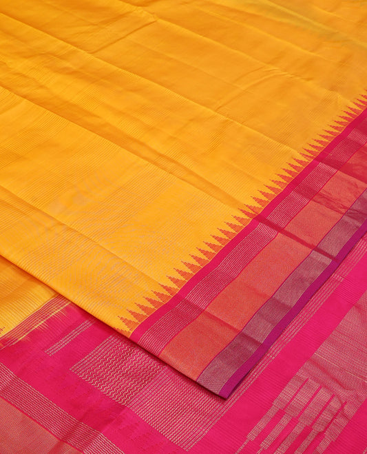 Yellow striped Bangalore silk saree, contrast ganga jamuna temple border, and temple design pallu