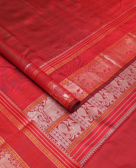 Red thread buttas Kanchipuram silk saree, rettai pettu border of rekku, rudraksham, yaanai, and Pichwai cow designs, and pallu features Vrishabha Kunjara design