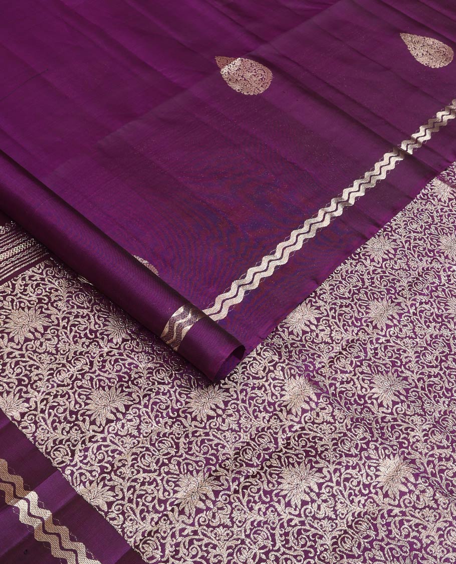 Purple thilakam zari buttas woven soft silk saree, zig-zag stripes border, and floral jaal pallu