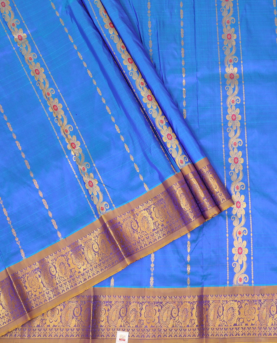Blue zari design pure-silk half-saree with contrast border of floral-paisley zari designs, contrast zari bordered blouse, and a dhavani of jaal designs