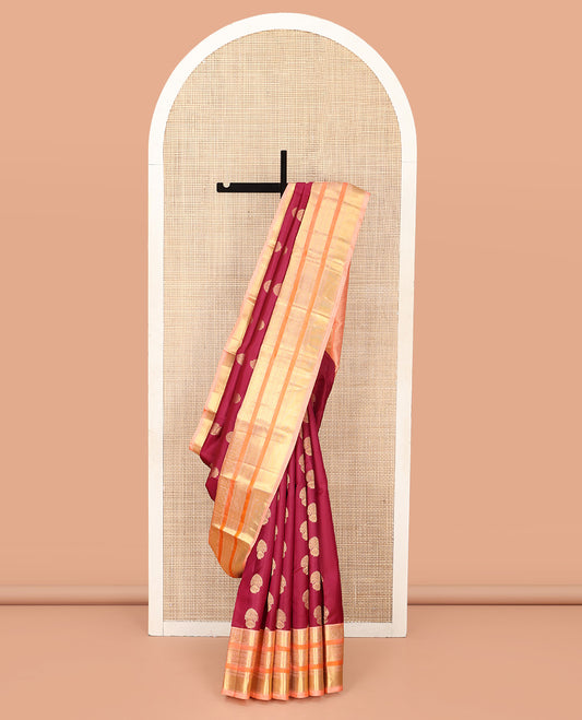 Maroon Vasundhara Silk Saree, Detailed with Floral Zari Buttas All Over Its Body, Complemented by a Contrast Border of Salngai, Mayil, Rettai Neli, and Kodi Visiry Designs, Pallu Steeped with Kodi Visiry Designs, and Paired with a Contrast Blouse