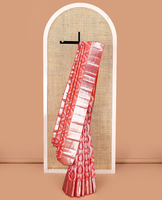 Orange jacquard kanchipuram silk saree, zari border, and zari woven pallu of intricate designs