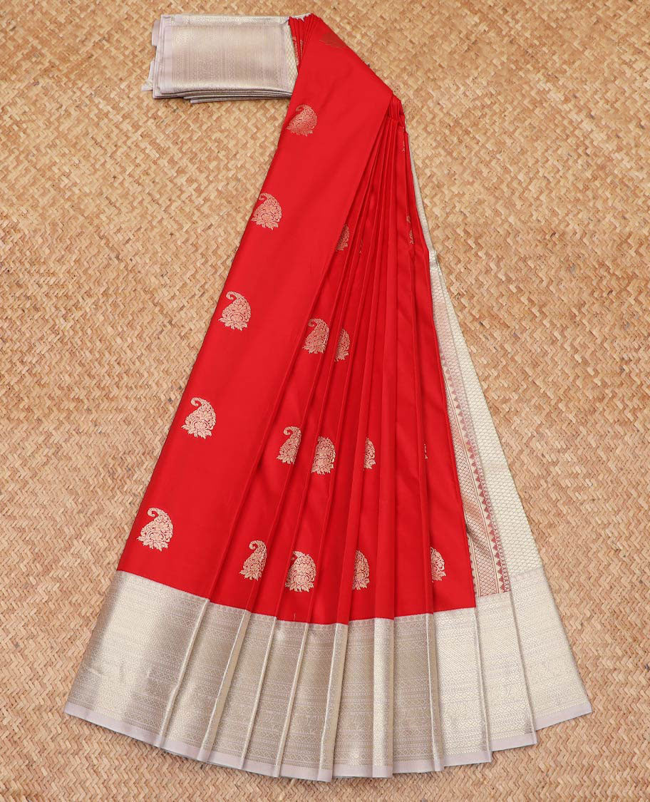 Red Budget Silk Saree Enthralled with Paisley Zari Buttas, Complemented by a Contrast Border Steeped with Traditional Zari Designs, Subtly Designed Jaal Pallu, and Paired with a Contrast Blouse