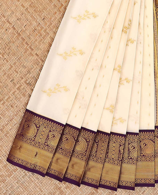 Cream zari buttas gift saree, contrast traditional design border, and pallu of big paisley designs