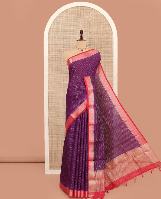 Purple Assam Silk Saree, Spotlighted with Zari Stripes on Its Body, Complemented by a Contrast Temple Zari Border, Pallu Gleamed Up with Zari Stripes, and Paired with a Contrast Blouse