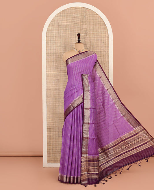Purple Assam Silk Saree Delicately Woven with Zari Stripes, Complemented by Captivating Contrast Traditional Zari Border, Scintillating Zari Striped Pallu, and Paired with a Contrast Blouse