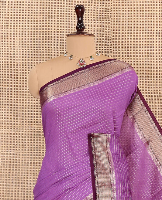 Purple Assam Silk Saree Delicately Woven with Zari Stripes, Complemented by Captivating Contrast Traditional Zari Border, Scintillating Zari Striped Pallu, and Paired with a Contrast Blouse