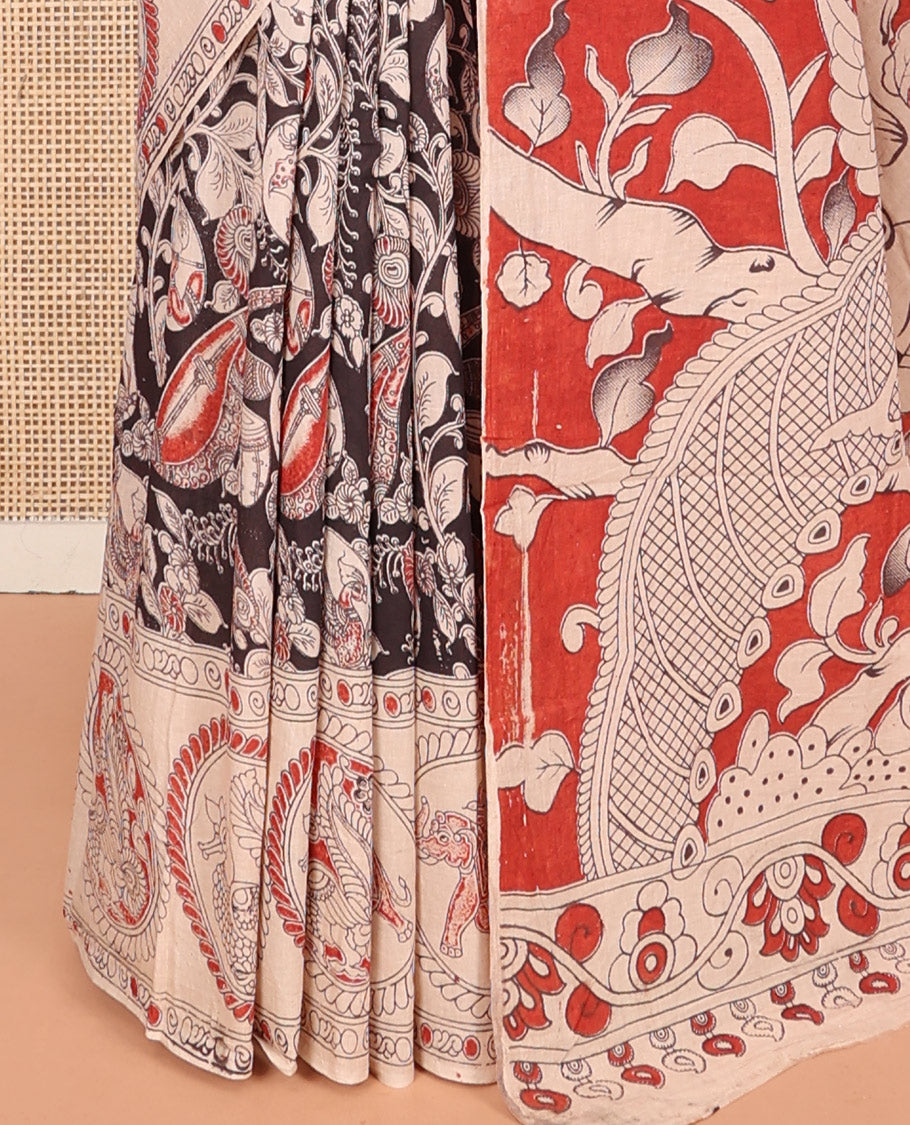 Black Machine-Printed Kalamkari Cotton Saree Features Flora-Fauna Design, Contrast Round Peacock Printed Border, Pallu of Fauna Design, and a Contrast Blouse