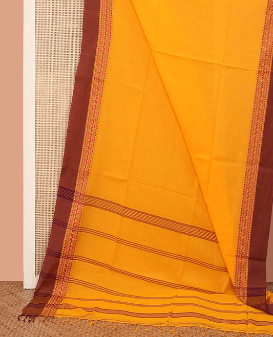 Orange Plain Khadi Cotton Saree, Complemented by a Contrast Traditional Motifs Thread Woven Border, Pallu Features Stripes, and Comes Without a Blouse