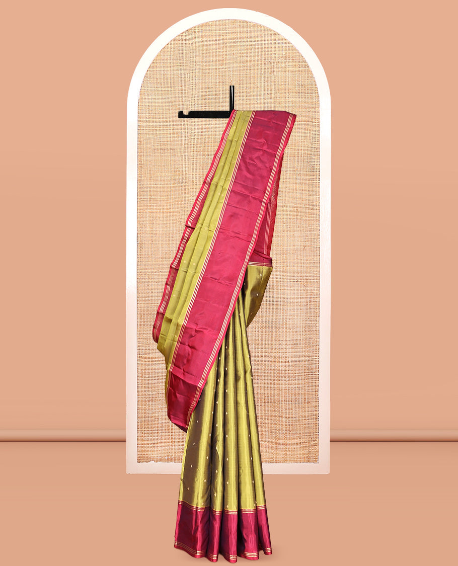 Green Vasundhara Lite-Silk Mix Saree, Beautifully Decorated with Zari Buttas All Over Its Body, Complemented by Contrast Rettai Pettu Border of Zari Stripes, Pallu Accentuated with Jaal Designs, and Paired with a Contrast Blouse