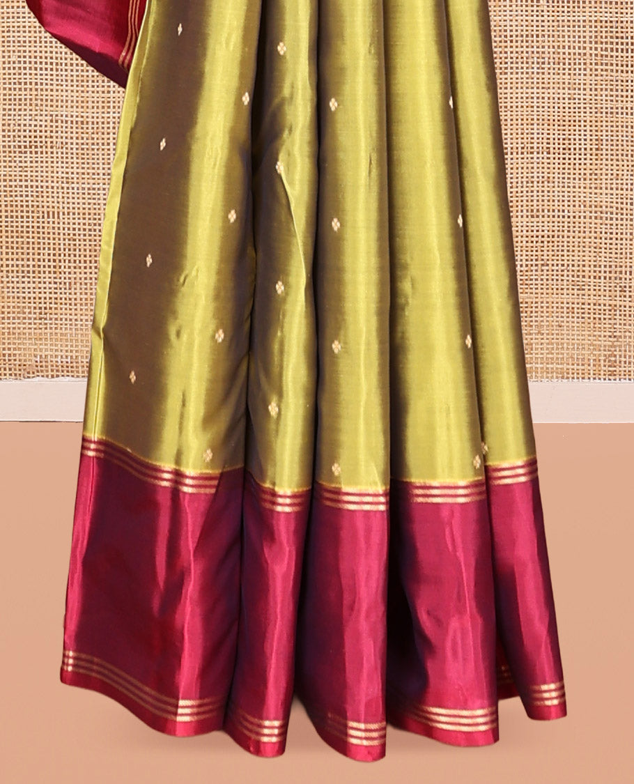 Green Vasundhara Lite-Silk Mix Saree, Beautifully Decorated with Zari Buttas All Over Its Body, Complemented by Contrast Rettai Pettu Border of Zari Stripes, Pallu Accentuated with Jaal Designs, and Paired with a Contrast Blouse