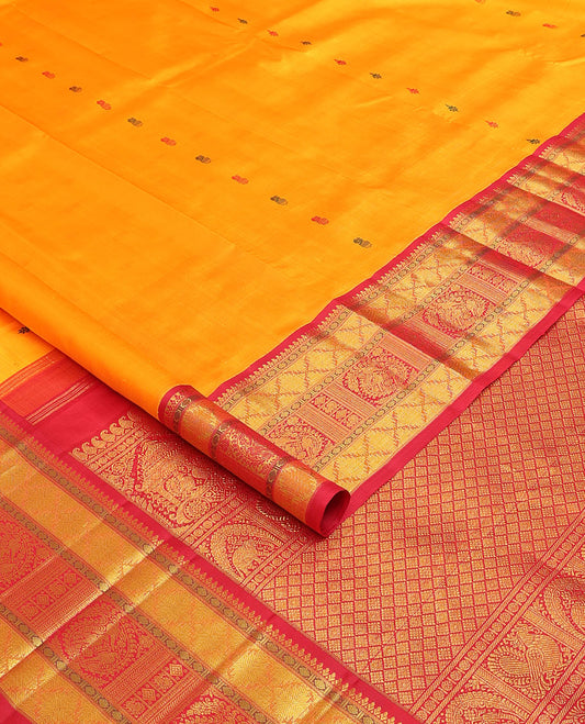 Yellow buttas Kanchipuram silk saree, contrast border of rudraksham, thazampoo rekku, arumbu manga, kathir, diamond, and mayil designs, and jaal pallu