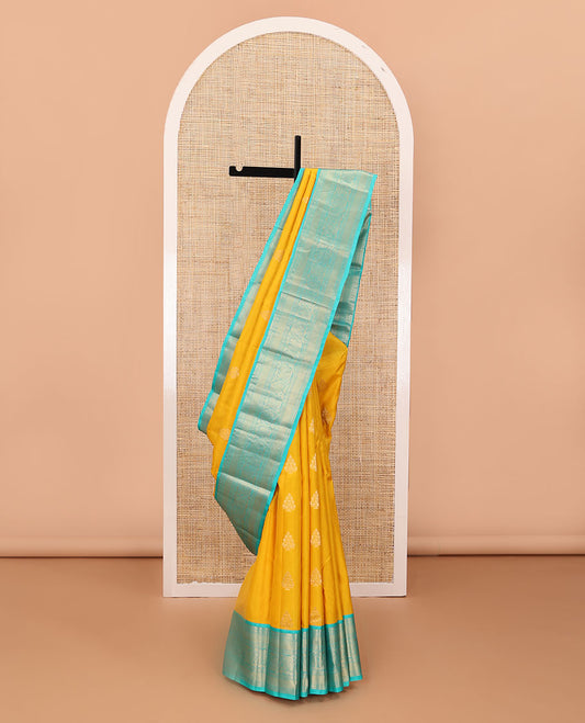 Yellow zari buttas silk saree, contrast border of salangai,neli,lavangam,mayil kann & dhavana kodi & jaal pallu