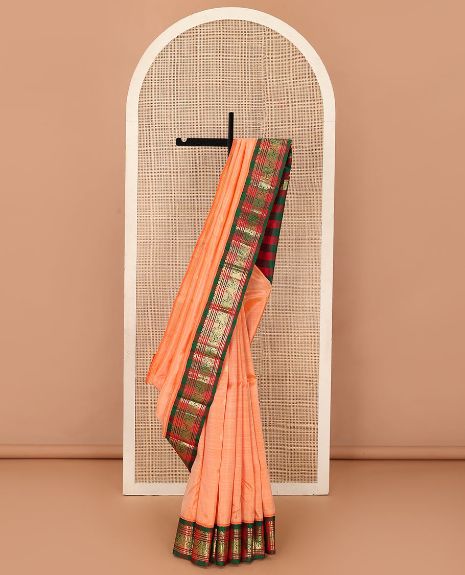 Peach zari buttas Kanchipuram silk saree, contrast one-sided korvai border of neli, and jadai nagam designs, and zari design pallu