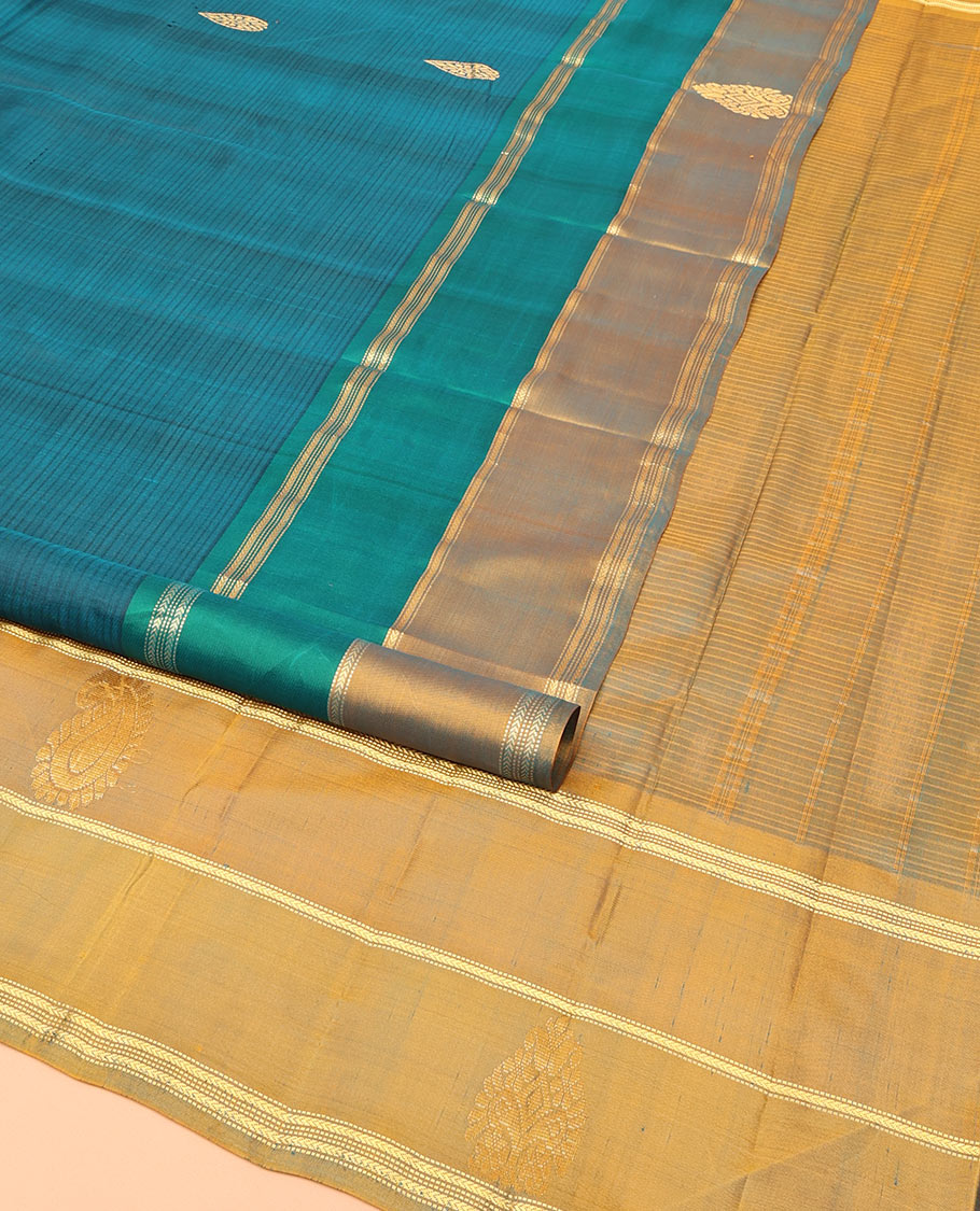 Peacock Blue Kanchipuram Silk Saree, Elevated with Zari Buttas and Vazhaipoo Stripes on Its Body, Complemented by a Contrast Border of Muthu, Kathir, and Arumbu Manga Designs, Pallu of Zari Designs, and Paired with a Contrast Blouse