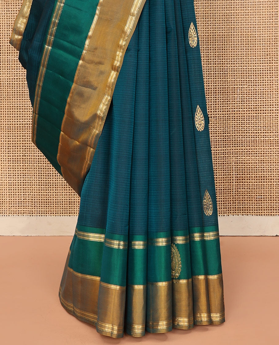 Peacock Blue Kanchipuram Silk Saree, Elevated with Zari Buttas and Vazhaipoo Stripes on Its Body, Complemented by a Contrast Border of Muthu, Kathir, and Arumbu Manga Designs, Pallu of Zari Designs, and Paired with a Contrast Blouse