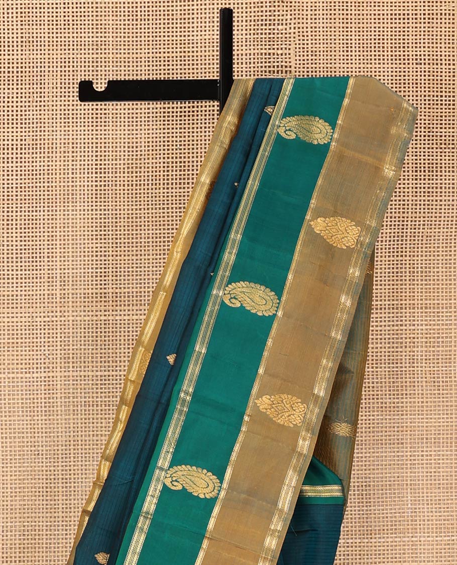 Peacock Blue Kanchipuram Silk Saree, Elevated with Zari Buttas and Vazhaipoo Stripes on Its Body, Complemented by a Contrast Border of Muthu, Kathir, and Arumbu Manga Designs, Pallu of Zari Designs, and Paired with a Contrast Blouse