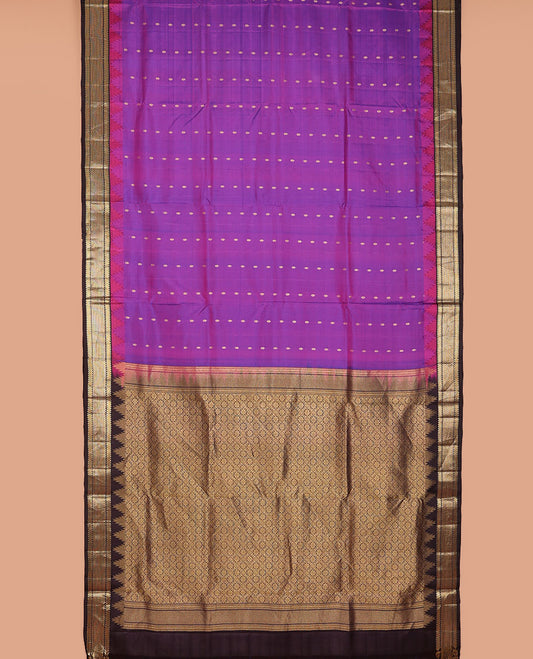 Purple nine-yard silksaree with zari buttas,contrast thazampoo reku border of ara bogudi,muthu & ara maadam & jaal pallu