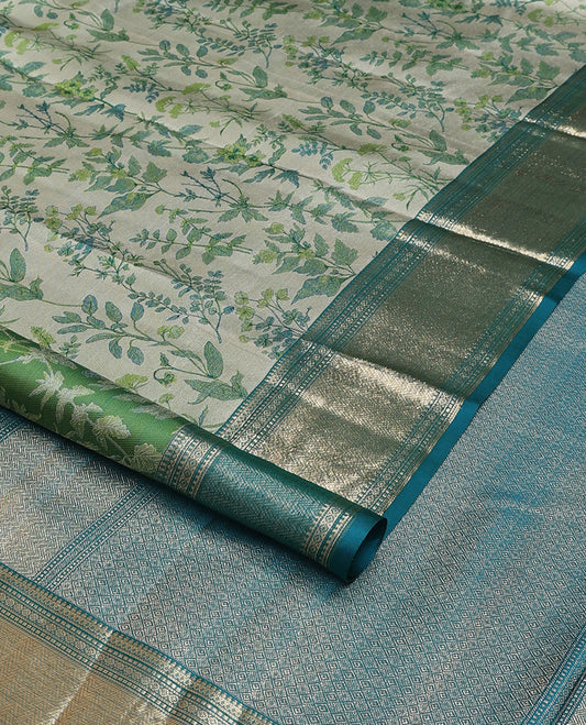 Green leaf printed silk saree, contrast border of thilakam mokku, muthu, diamond, and vanki designs, and jaal pallu