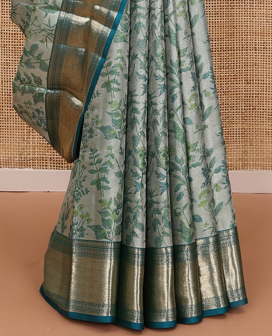 Green leaf printed silk saree, contrast border of thilakam mokku, muthu, diamond, and vanki designs, and jaal pallu