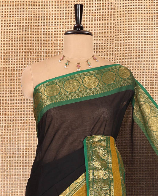 Black plain Chettinad cotton saree, contrast traditional design rettai pettu border of peacock chakram, striped pallu, and a matching blouse