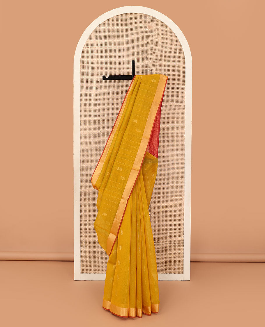 Mustard zari striped silk cotton saree, contrast bavanji border, and contrast pallu of floral creeper designs