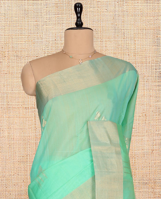 Green Silk Cotton Saree, Graced with Zari Buttas, a Zari Border, Gleaming Zari Pallu, and a Matching Blouse
