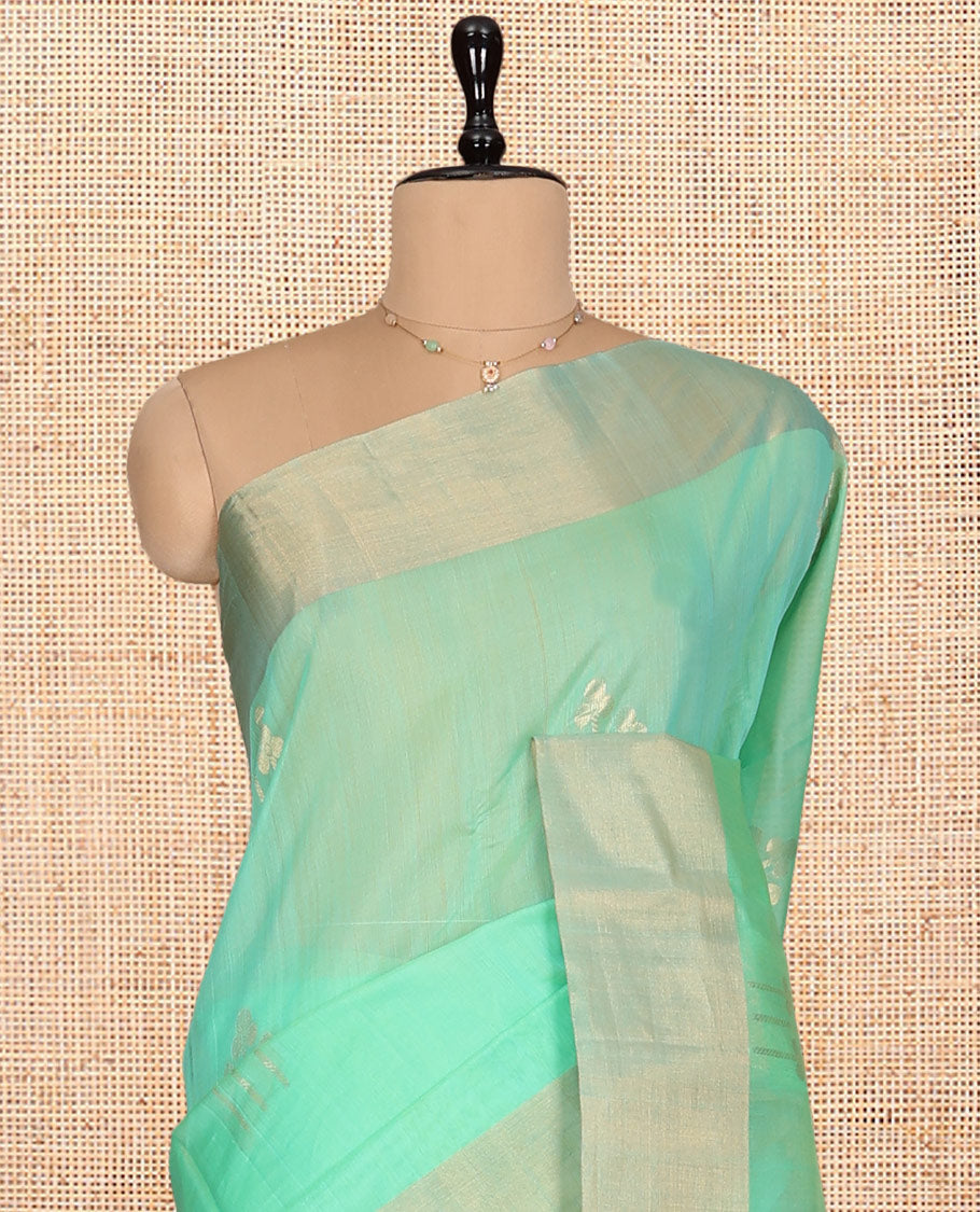 Green Silk Cotton Saree, Graced with Zari Buttas, a Zari Border, Gleaming Zari Pallu, and a Matching Blouse