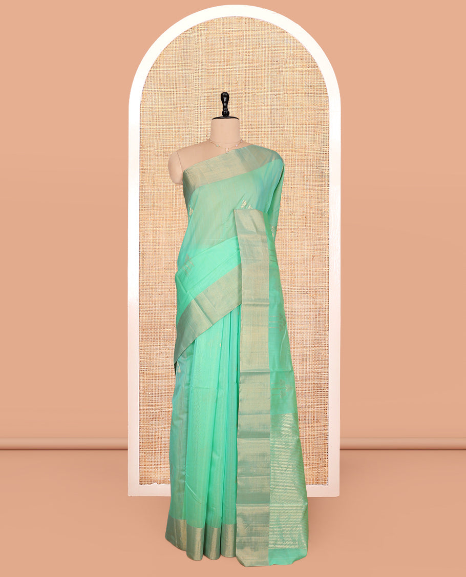 Green Silk Cotton Saree, Graced with Zari Buttas, a Zari Border, Gleaming Zari Pallu, and a Matching Blouse