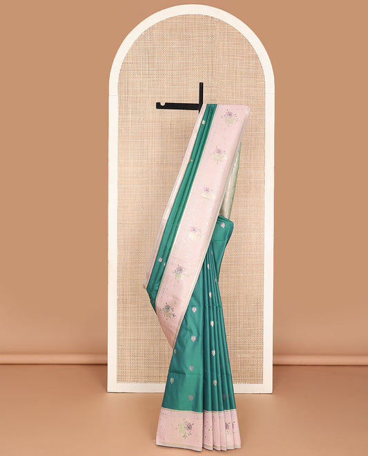 Green semi-soft silk saree with zari buttas, contrast zari check border of floral design & thick zari woven floral designs
