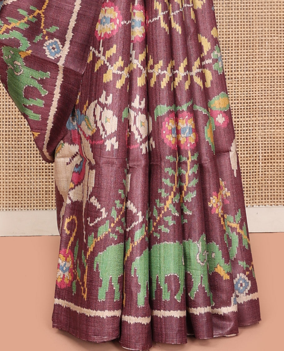 Brown Tussar Silk Saree, Artfully Detailed with Flora, Fauna, and Human Figurines Print on Its Body, a Subtle Border, Pallu Mirrors the Same Print, and Paired with a Matching Blouse