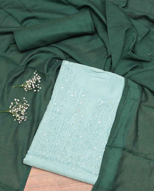 Pale Green Cotton Material Churidar Set, Delicately Designed with Sequined Thread Neck Work Top, a Contrast Plain Bottom, and Thread Dupatta