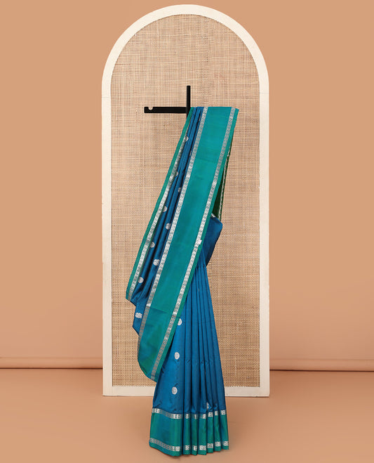 Blue peacock chakra buttas Venkatagiri silk saree, contrast rettai pettu rudraksham border, and thilakam design pallu