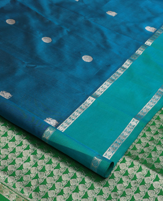 Blue peacock chakra buttas Venkatagiri silk saree, contrast rettai pettu rudraksham border, and thilakam design pallu