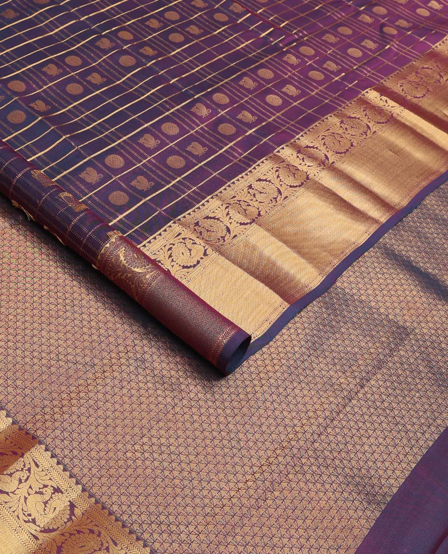 Purple annam chakram enclosed zari checked Vasundhara silk mix saree, zari border of rekku and kodi mayil designs, and jaal pallu